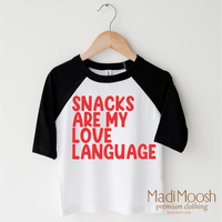 Snacks Are My Love Language Valentine's Day design on a black-accented shirt.