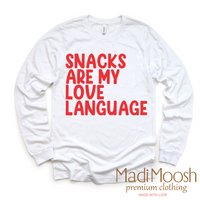 Snacks Are My Love Language Valentine's Day design on a long sleeve shirt.