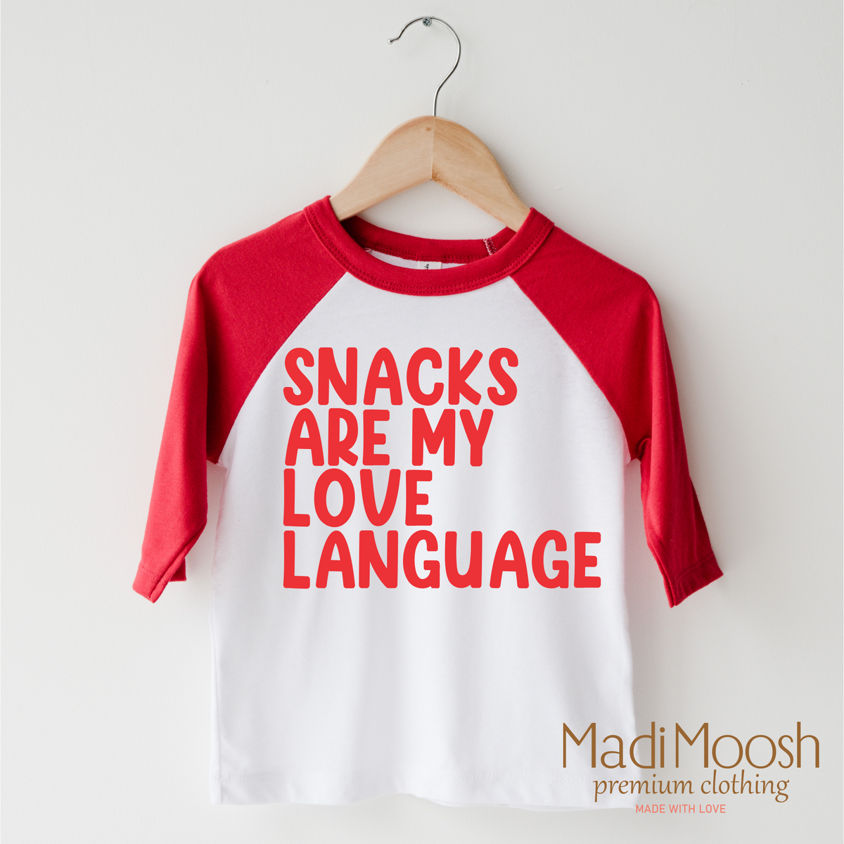 Snacks Are My Love Language Valentine's Day design on a red-accented shirt.