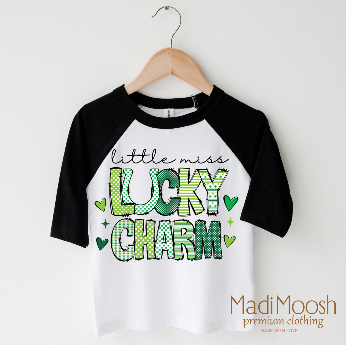 Lucky Charm St. Patrick's Day design on a black-accented shirt.