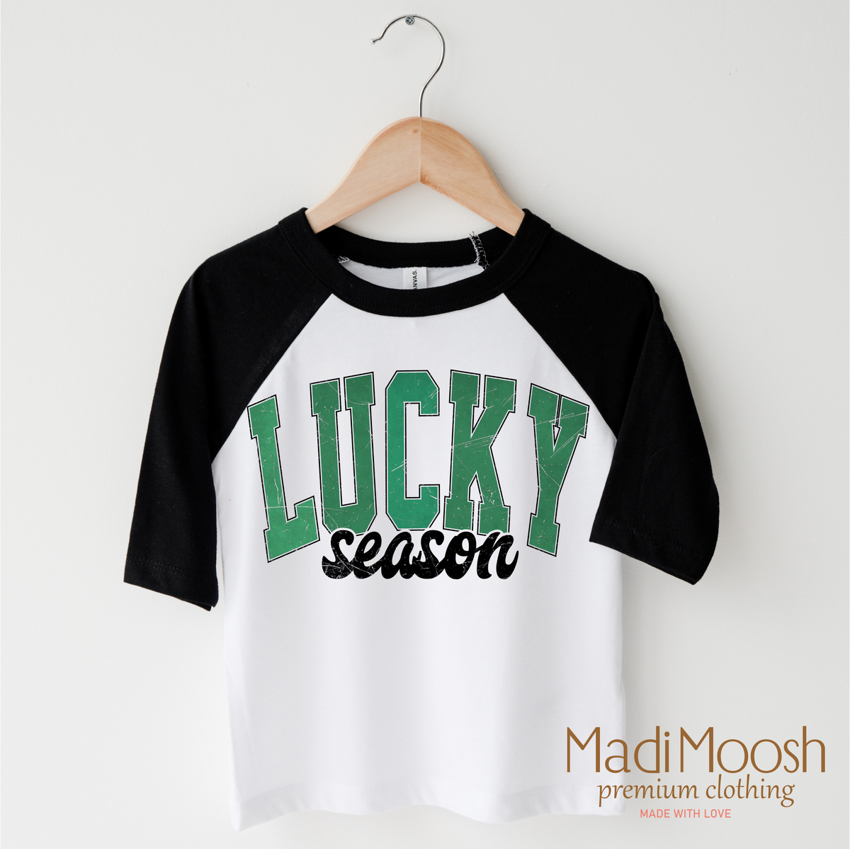 Lucky Season St. Patrick's Day design on a black-accented shirt.