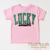 Lucky Season St. Patrick's Day design on a pink garment.
