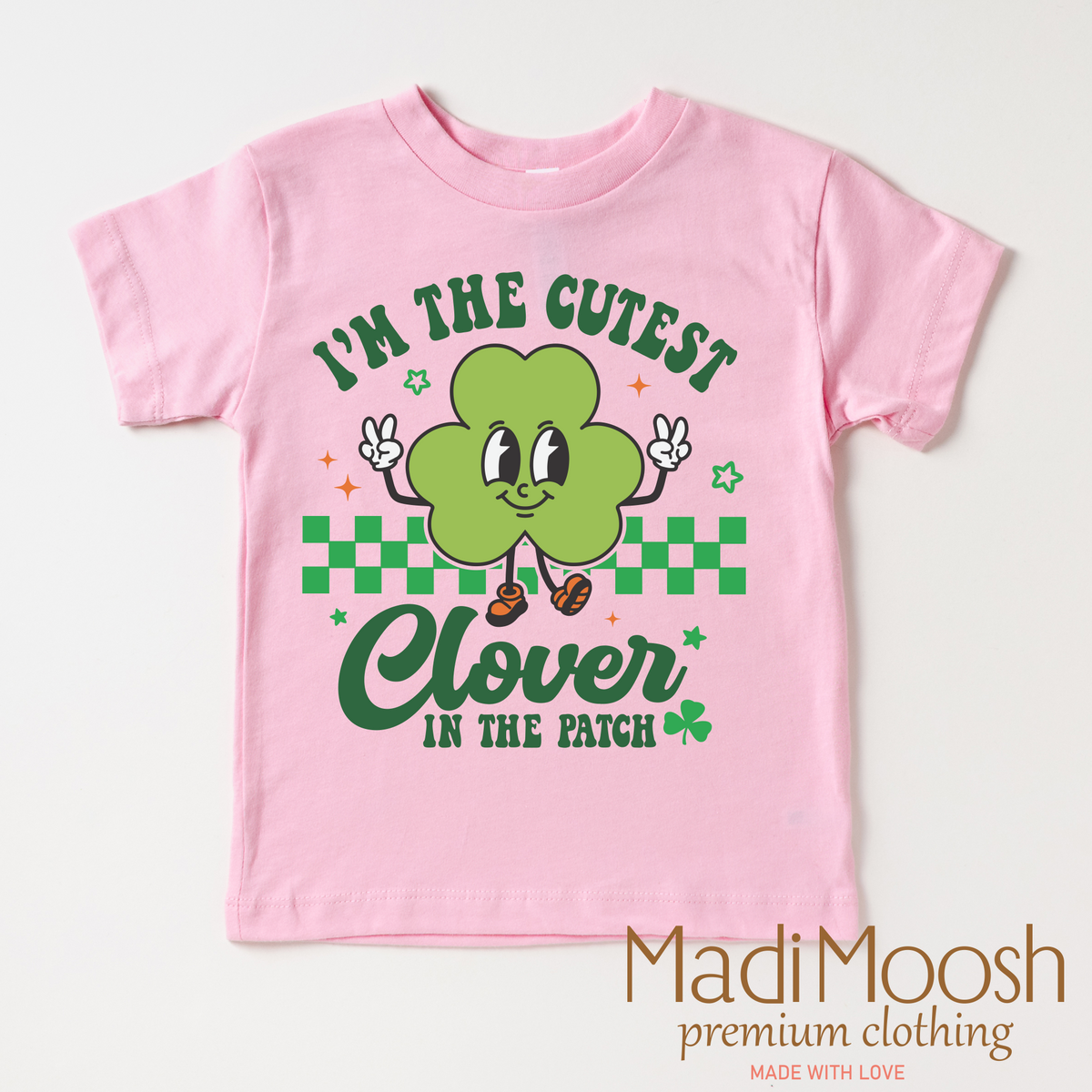 I'm The Cutest Clover In The Patch St. Patrick's Day design on a pink garment.