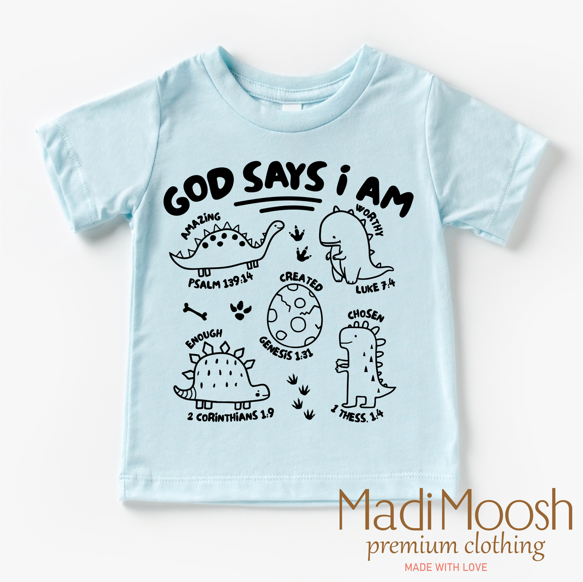 God Says I Am Dinosaur design on a blue garment.