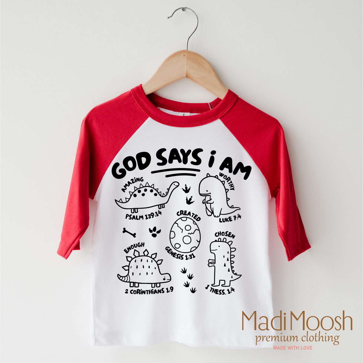 God Says I Am Dinosaur design on a red-accented shirt.
