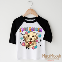 Stay Golden Golden Retriever design on a black-accented shirt.