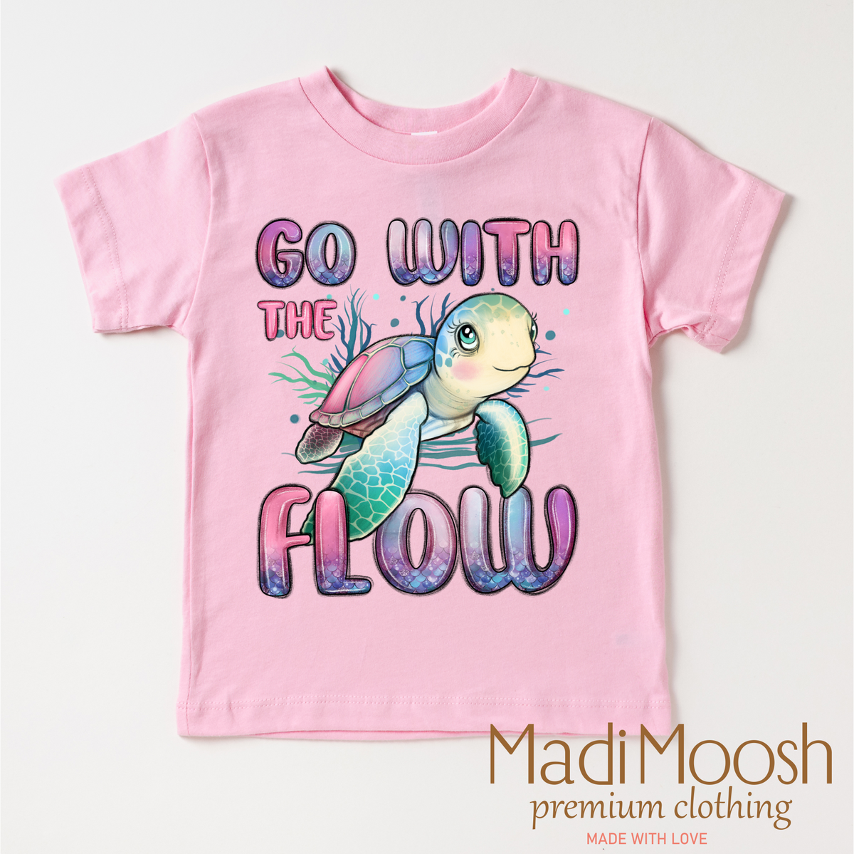 Go With The Flow Turtle design on a pink garment.