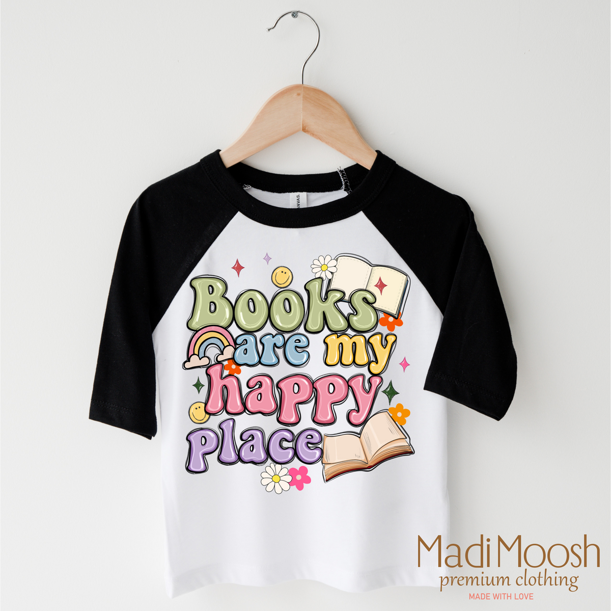 Books Are My Happy Place design on a black-accented shirt.