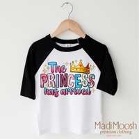 The Birthday Princess Has Arrived design on a raglan shirt with black sleeves.