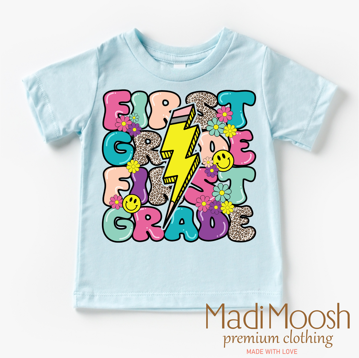 First Grade Lightning Bolt Back To School design on a blue garment.
