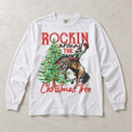 White Comfort Colors long-sleeve tee featuring Rockin Around the Christmas Tree cowboy and bucking horse graphic