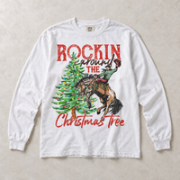 White Comfort Colors long-sleeve tee featuring Rockin Around the Christmas Tree cowboy and bucking horse graphic