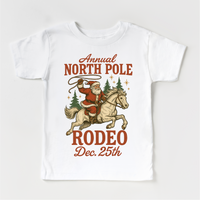 North Pole Rodeo Cowboy Christmas design on a white garment.