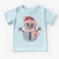 Faux Woven Snowman Christmas design on a blue garment.