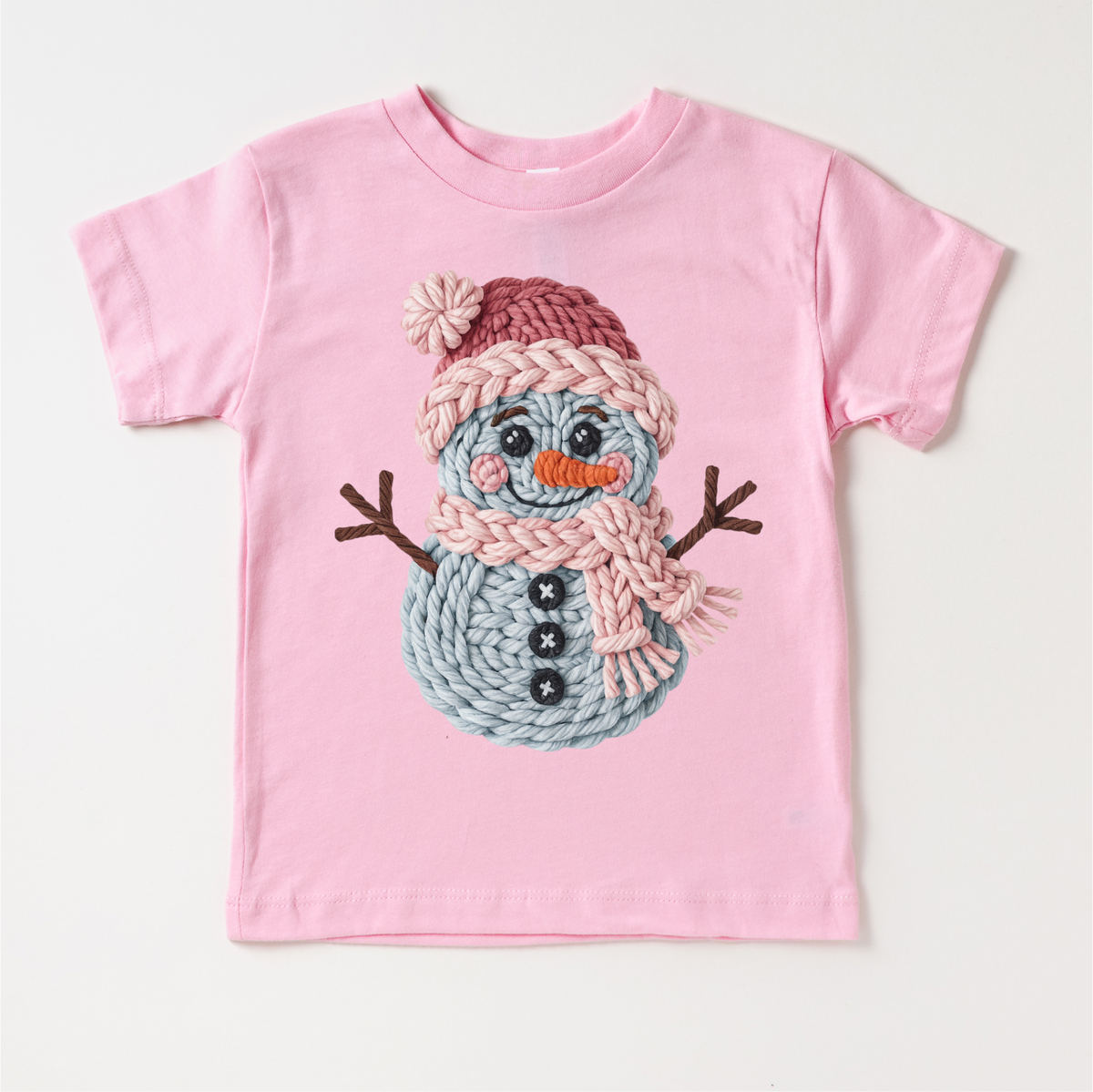 Faux Woven Snowman Christmas design on a pink garment.
