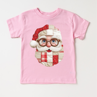 Faux Santa Patchwork Christmas design on a pink garment.