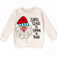 Santa Claus Is Coming To Town Christmas design on a natural sweatshirt.