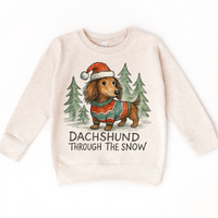 Dachshund Through The Snow Christmas design on a natural sweatshirt.
