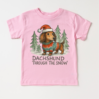 Dachshund Through The Snow Christmas design on a pink garment.