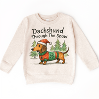 Dachshund Through The Snow Christmas design on a natural sweatshirt.