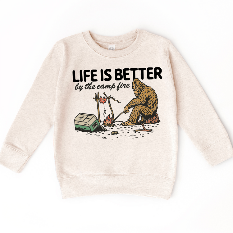 Life Is Better by the Campfire Kids T-Shirt | Funny Sasquatch Camping Tee | Outdoor Adventure Kids Shirt | Bigfoot Graphic Tee