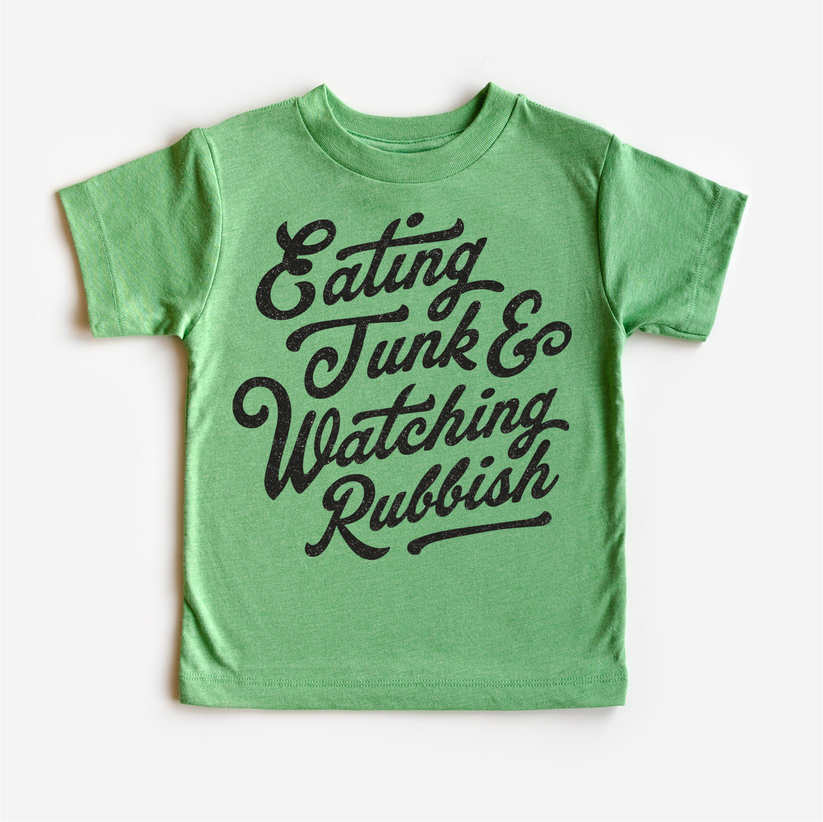 Eating Junk And Watching Rubbish Christmas design on a green garment.