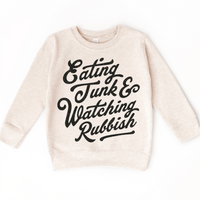 Eating Junk And Watching Rubbish Christmas design on a natural sweatshirt.