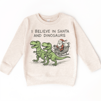 I Believe In Santa And Dinosaurs Christmas design on a natural sweatshirt.