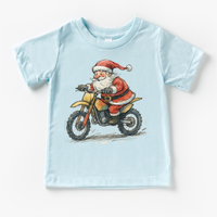 Santa Riding A Motocross Dirt Bike design on a blue garment.