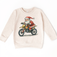 Santa Riding A Motocross Dirt Bike design on a natural sweatshirt.