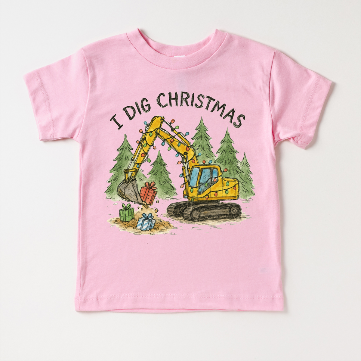 I Dig Christmas Excavator design on a pink garment.