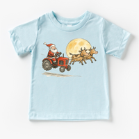 Santa Tractor And Cows Farm design on a blue garment.