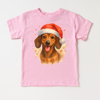 Christmas Dachshund Santa Dog design on a pink garment.