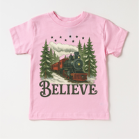 Vintage Train Christmas design on a pink garment.