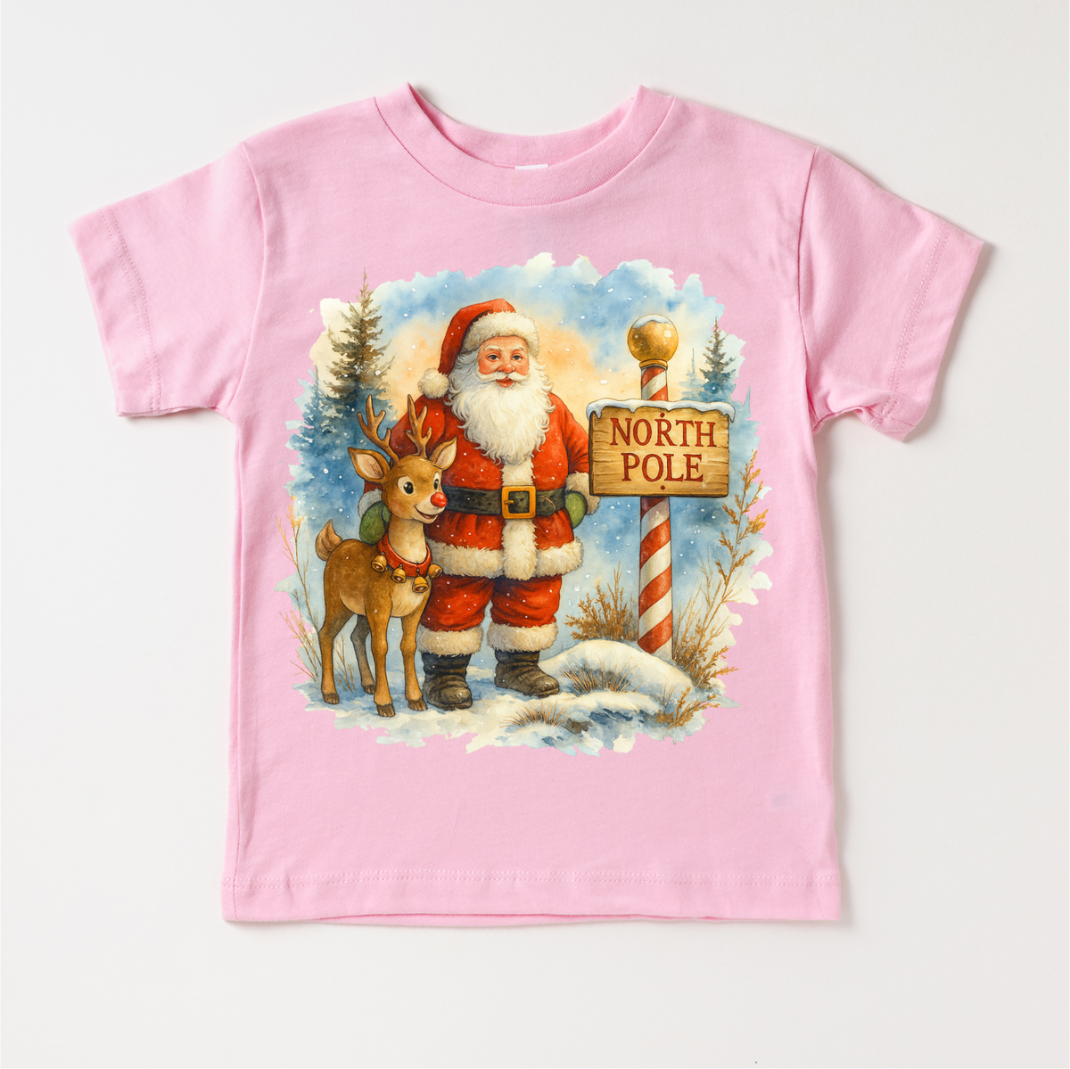 Santa and Rudolph North Pole Christmas design on a pink garment.