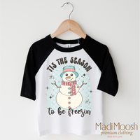 Tis The Season To Be Freezing Christmas design on a black-accented shirt.