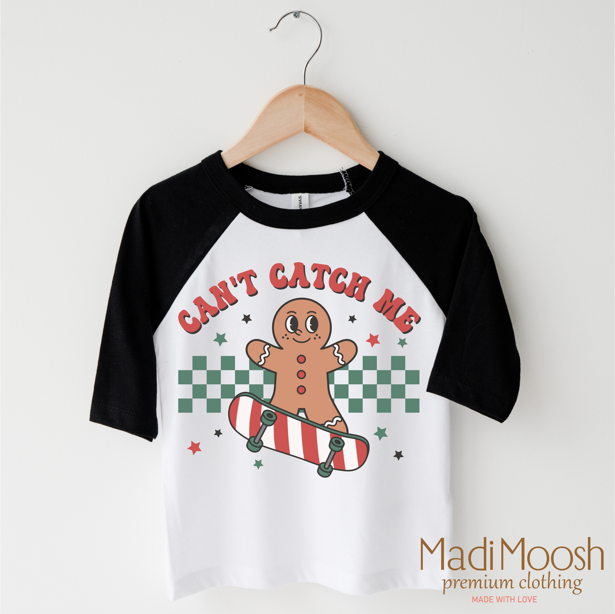 Can't Catch Me Gingerbread Man Christmas design on a black-accented shirt.