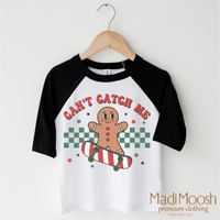 Can't Catch Me Gingerbread Man Christmas design on a black-accented shirt.