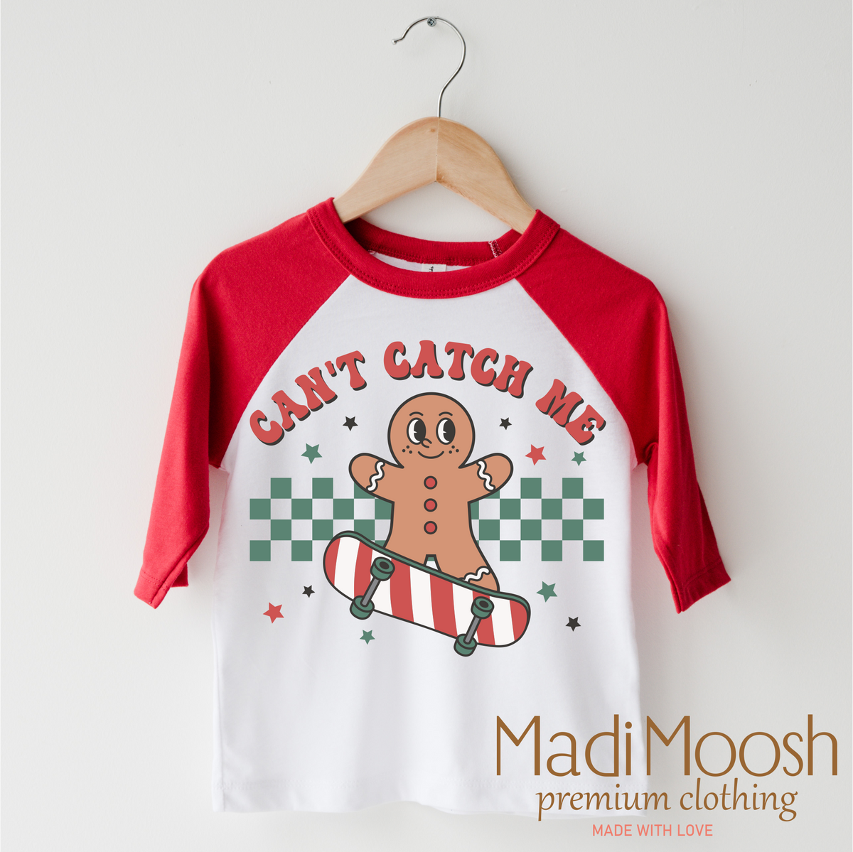 Can't Catch Me Gingerbread Man Christmas design on a red-accented shirt.