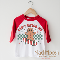 Can't Catch Me Gingerbread Man Christmas design on a red-accented shirt.