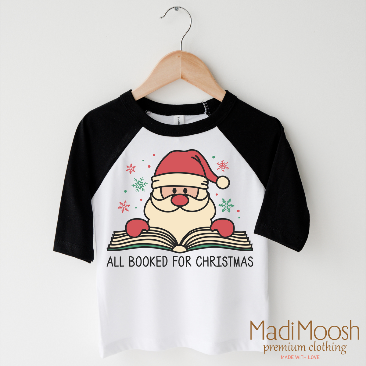 All Booked Santa Christmas design on a black-accented shirt.