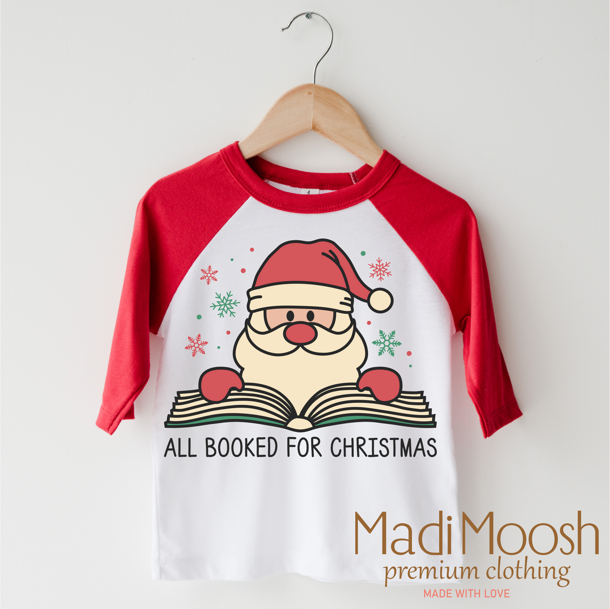 All Booked Santa Christmas design on a red-accented shirt.