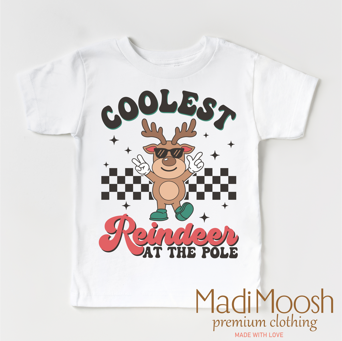 Coolest Reindeer At The Pole Christmas design on a white garment.