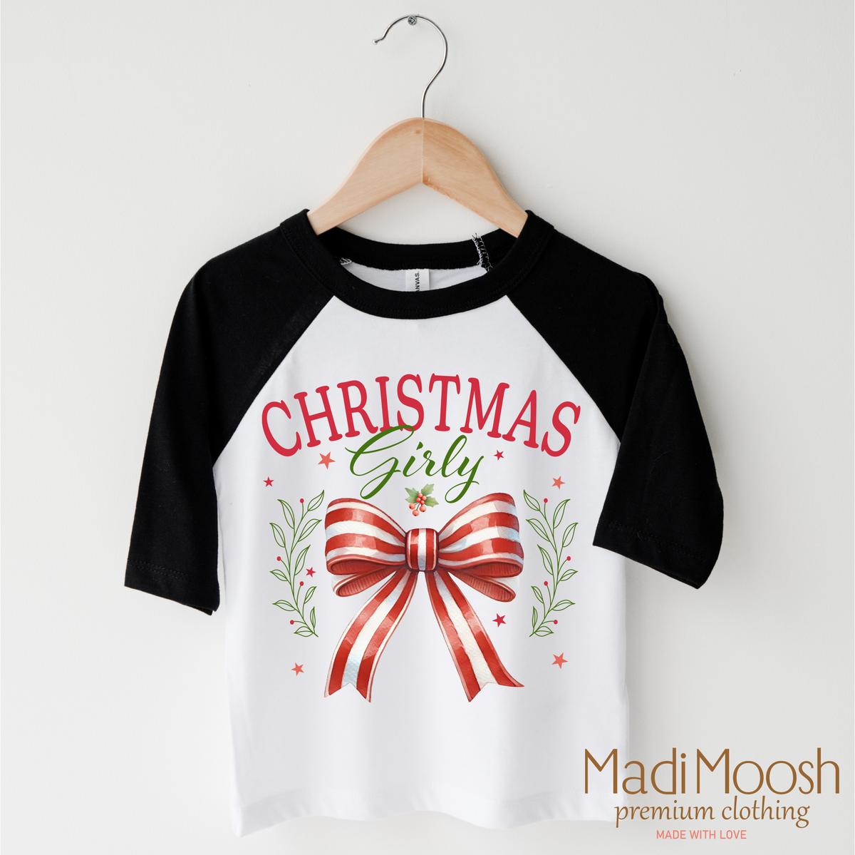 Christmas Girly Bow design on a black-accented shirt.