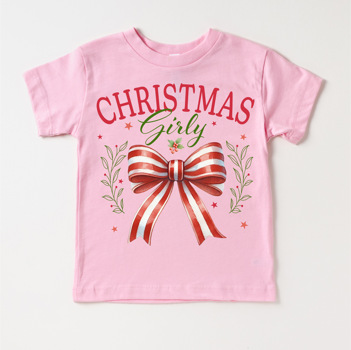 Christmas Girly Bow design on a pink garment.