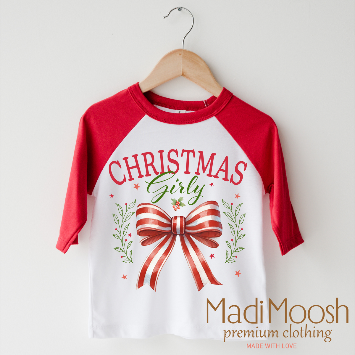 Christmas Girly Bow design on a red-accented shirt.