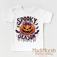 Spooky Season Pumpkin design on a white garment.