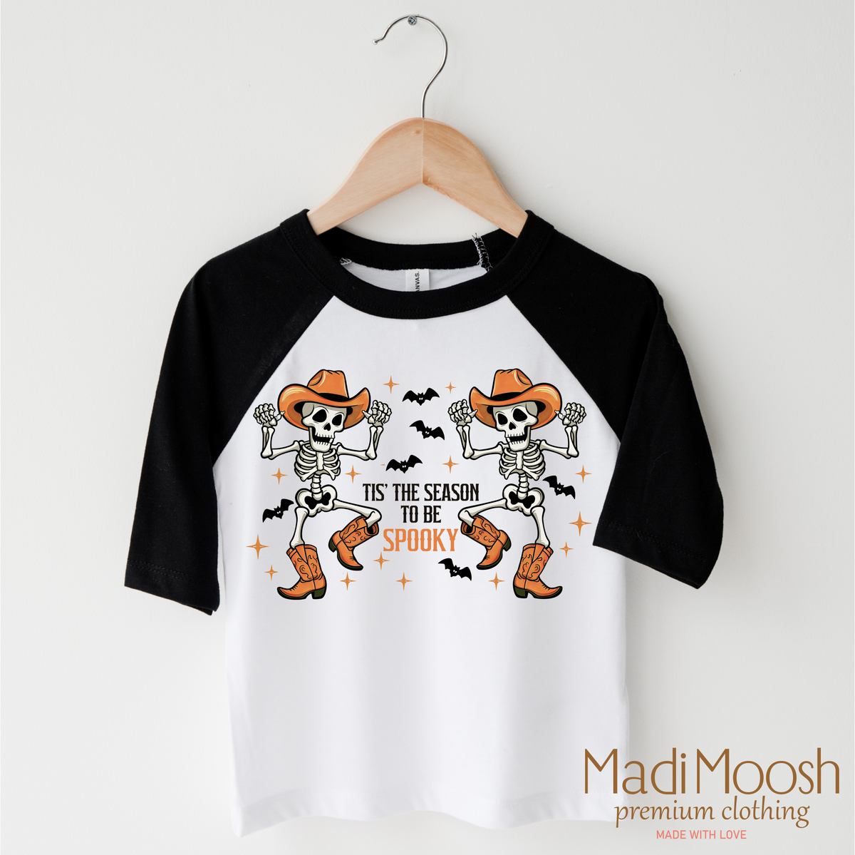 Tis The Season To Be Spooky Cowboy Version design on a black-accented shirt.