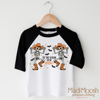 Tis The Season To Be Spooky Cowboy Version design on a black-accented shirt.