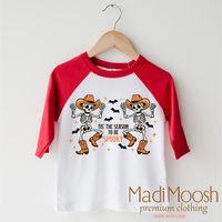 Tis The Season To Be Spooky Cowboy Version design on a red-accented shirt.